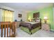 Inviting bedroom features a comfortable bed, matching nightstands with lamps, and soft, neutral-colored walls at 2613 Santosh Cv, Kissimmee, FL 34746
