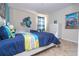 Bedroom with twin beds, cartoon-themed decor, and a cheerful, welcoming atmosphere at 2613 Santosh Cv, Kissimmee, FL 34746