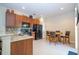 Functional kitchen featuring dark appliances, granite countertops, and a tile backsplash at 2613 Santosh Cv, Kissimmee, FL 34746