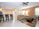 Inviting living area with breakfast bar seating, tile floors, and comfortable sofas at 2613 Santosh Cv, Kissimmee, FL 34746