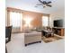 Bright living room featuring tile floors, sofas, and a ceiling fan at 2613 Santosh Cv, Kissimmee, FL 34746