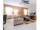 Cozy living room with neutral tones, comfortable seating, and a ceiling fan for added comfort at 2613 Santosh Cv, Kissimmee, FL 34746