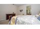 Bright main bedroom offering a view of the en-suite bathroom and stylish furniture at 2613 Santosh Cv, Kissimmee, FL 34746