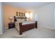 Comfortable main bedroom featuring an accent wall, large bed, and modern lighting at 2613 Santosh Cv, Kissimmee, FL 34746