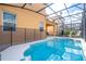 Enjoy this private screened-in pool with lounge chairs, perfect for relaxation and entertaining at 2613 Santosh Cv, Kissimmee, FL 34746