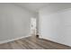 Empty bedroom with wood-style flooring and a closet with a view of another room at 2640 Sw 156Th Lane Rd, Ocala, FL 34473