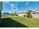 Spacious backyard with well-maintained lawn, playground, and privacy fence at 2714 Forestdale St, St Cloud, FL 34771