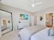 Bright bedroom with a TV, closet and mirror offers ample space and storage at 2714 Forestdale St, St Cloud, FL 34771