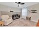 Cozy Bedroom featuring a crib, comfortable chair, and soft lighting at 2714 Forestdale St, St Cloud, FL 34771