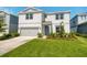 Charming two-story home with a well-maintained lawn and a two-car garage at 2714 Forestdale St, St Cloud, FL 34771