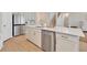 Bright kitchen boasts stainless appliances, quartz countertops, and modern fixtures at 2714 Forestdale St, St Cloud, FL 34771