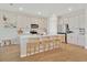 Modern kitchen features white cabinets, quartz countertops, and stainless steel appliances at 2714 Forestdale St, St Cloud, FL 34771