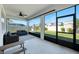 Screened lanai offers outdoor living space with ceiling fan and views of the backyard at 2714 Forestdale St, St Cloud, FL 34771