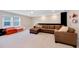 Spacious living room with comfortable seating and plenty of natural light from the large window at 2714 Forestdale St, St Cloud, FL 34771
