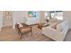 Bright living room with modern decor, comfortable seating, a large window, and a neutral color palette at 2714 Forestdale St, St Cloud, FL 34771