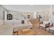 Open-concept living space featuring modern decor, a large sectional sofa, and seamless flow to the kitchen at 2714 Forestdale St, St Cloud, FL 34771