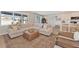 Comfortable living room featuring a sectional sofa, and a view of kitchen at 2714 Forestdale St, St Cloud, FL 34771
