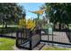 Community playground with safety fencing and modern play equipment at 2714 Forestdale St, St Cloud, FL 34771