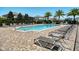 Community pool with lounge chairs for relaxing and enjoying the sun at 2714 Forestdale St, St Cloud, FL 34771