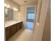 Bathroom with double vanity and a neutral color scheme at 2765 Redblush Ter, St Cloud, FL 34772