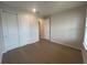 This bedroom has hardwood floors and a closet with sliding doors at 2765 Redblush Ter, St Cloud, FL 34772