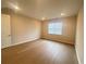 Cozy bedroom with wood floors, a window, and ample natural light at 2765 Redblush Ter, St Cloud, FL 34772