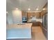 Modern kitchen with stainless steel appliances, a kitchen island, and wooden cabinets at 2765 Redblush Ter, St Cloud, FL 34772