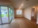 Bright and airy living room with access to a covered lanai through sliding glass doors at 2765 Redblush Ter, St Cloud, FL 34772