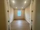 Empty room featuring wood floors, recessed lighting, and a window at 2765 Redblush Ter, St Cloud, FL 34772