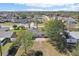 Aerial view showcasing the home's backyard with patio and cozy firepit area at 2801 W Covington Dr, Deltona, FL 32738