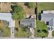Overhead view of property with a fenced backyard, patio, storage shed, and mature landscaping at 2801 W Covington Dr, Deltona, FL 32738