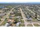 Community aerial view showcasing a neighborhood near a serene lake and abundant green spaces at 2801 W Covington Dr, Deltona, FL 32738