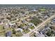 Overhead view of a sprawling residential development with easy access to a nearby lake at 2801 W Covington Dr, Deltona, FL 32738