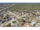 Overhead shot of the neighborhood featuring well-maintained homes and landscaping with mature trees and green spaces at 2801 W Covington Dr, Deltona, FL 32738