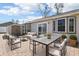 A brick-laid backyard patio features comfortable seating and an area for outdoor dining and relaxing at 2801 W Covington Dr, Deltona, FL 32738