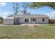 Backyard featuring a brick patio, storage shed, and well-maintained lawn at 2801 W Covington Dr, Deltona, FL 32738