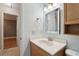 This bathroom features a wood cabinet and sink at 2801 W Covington Dr, Deltona, FL 32738