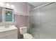 This bathroom features a mirror, vanity, and tiled shower at 2801 W Covington Dr, Deltona, FL 32738