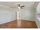 This bedroom features wood flooring and access to additional rooms at 2801 W Covington Dr, Deltona, FL 32738