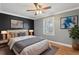 A bedroom showcases a blend of dark and light tones with natural light streaming through a window at 2801 W Covington Dr, Deltona, FL 32738