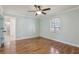 Tranquil bedroom featuring wood floors, a ceiling fan and lots of natural light at 2801 W Covington Dr, Deltona, FL 32738