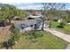 Angle aerial view showing a well-maintained lawn and attached two-car garage at 2801 W Covington Dr, Deltona, FL 32738