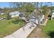 Aerial shot of a single-Gathering home with a driveway, lawn and a two car garage at 2801 W Covington Dr, Deltona, FL 32738