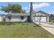 Charming single-story home with a well-maintained lawn and inviting curb appeal at 2801 W Covington Dr, Deltona, FL 32738