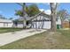 Charming single-story home with a well-maintained lawn, driveway, and a two car garage at 2801 W Covington Dr, Deltona, FL 32738