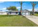 Charming single-story home with a well-maintained lawn, inviting curb appeal, and a two car garage at 2801 W Covington Dr, Deltona, FL 32738