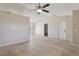 Spacious living room featuring tile floors and a ceiling fan with an open floor plan at 2801 W Covington Dr, Deltona, FL 32738