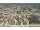 Wide angle aerial view of a suburban neighborhood featuring mature trees and green space at 2801 W Covington Dr, Deltona, FL 32738