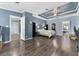 Large main bedroom with trey ceilings, dark wood floors, walk-in closet, and neutral paint at 36010 Kalamazoo Dr, Eustis, FL 32736