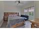 Bedroom featuring a full sized bed, futon, and natural lighting at 3725 Swindell Rd, Lakeland, FL 33810